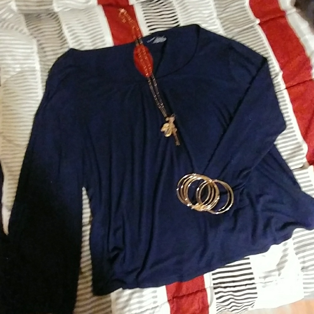 Cute tunic top with bell sleves and cold shoulder!